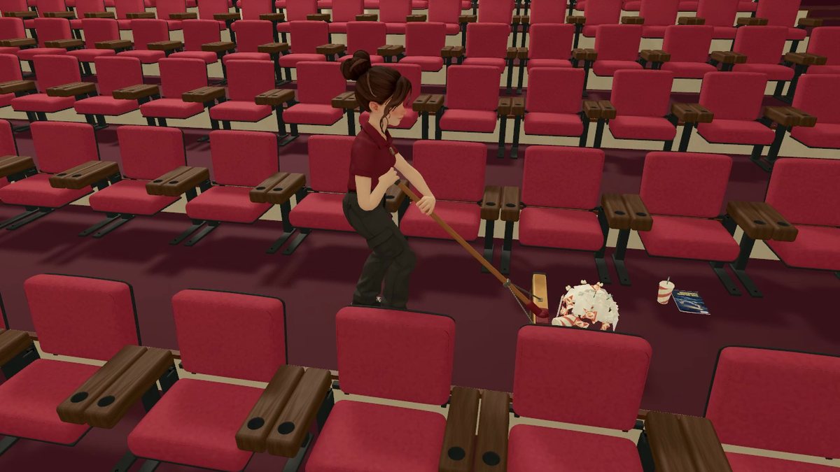 Melissa, a hired helper in a red staff shirt, sweeping a row of seats.